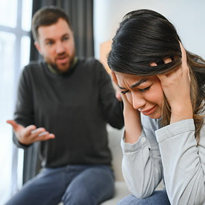 Man yelling at a crying woman, domestic violence attorney in Texas.