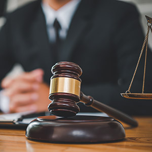 Legal representation with judge, gavel, and scales of justice, Consequences of a Misdemeanor.